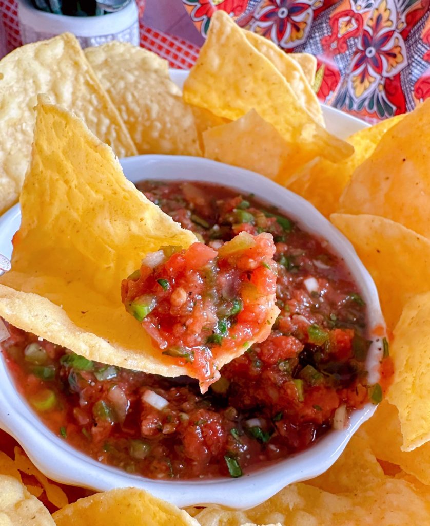 Chip with Salsa on it.