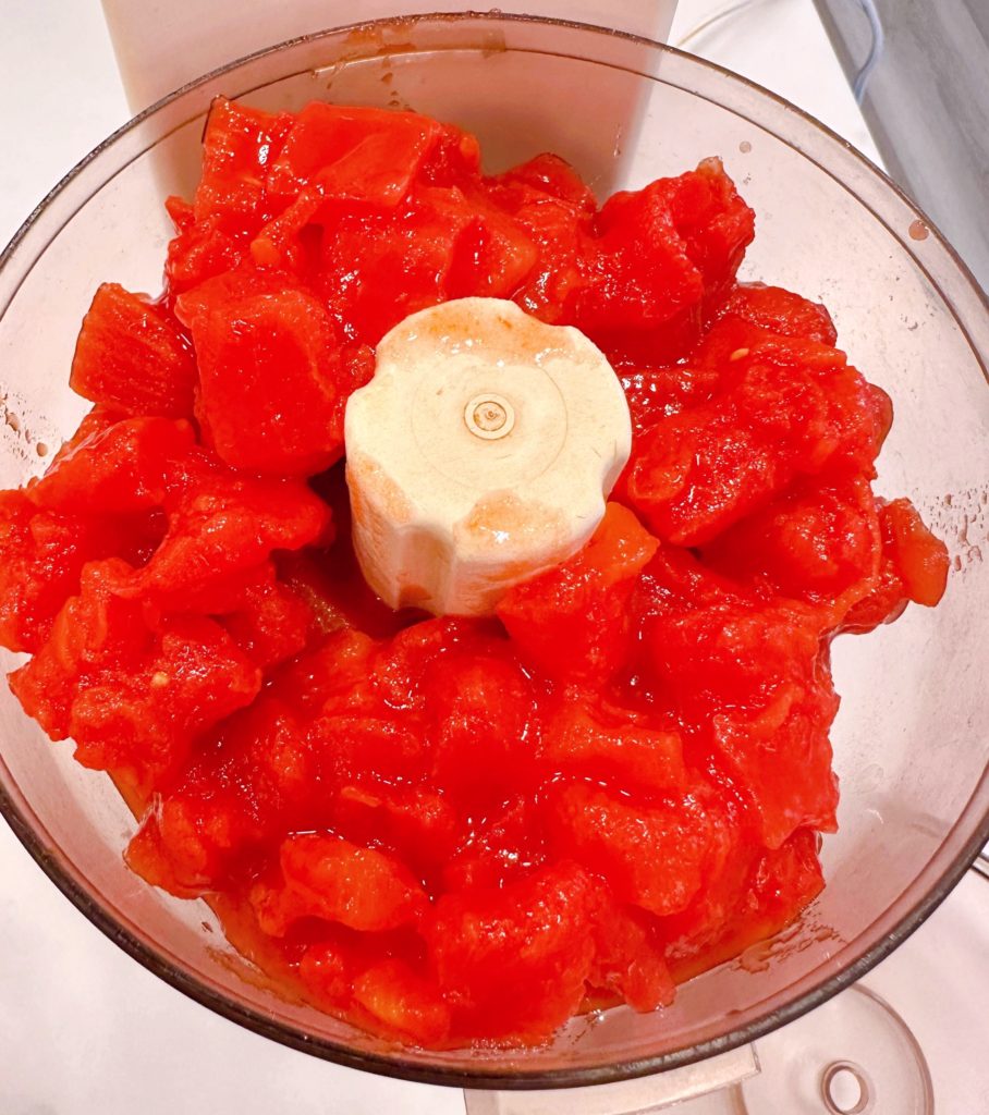 Processing tomatoes in the food processor.