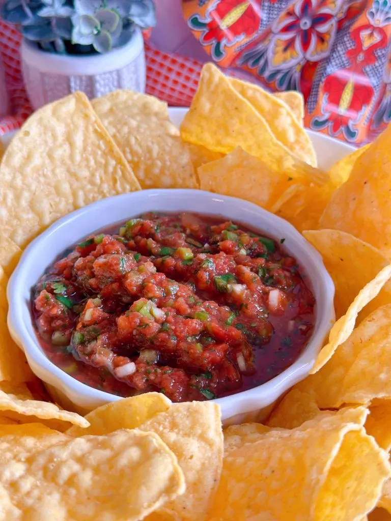 Chips and salsa in a serving bowl.