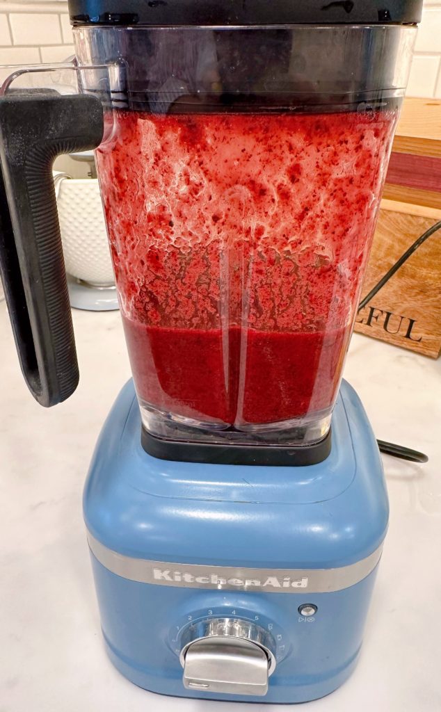 Blended berries and lemon mixture in blender.