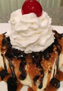 Close Up Fried Ice Cream on a plate with caramel sauce and hot chocolate sauce.