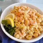 Shrimp Salad in a large bowl with lemon garnish.