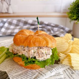 Chicken Salad Sandwiches with chips on a crossiant.