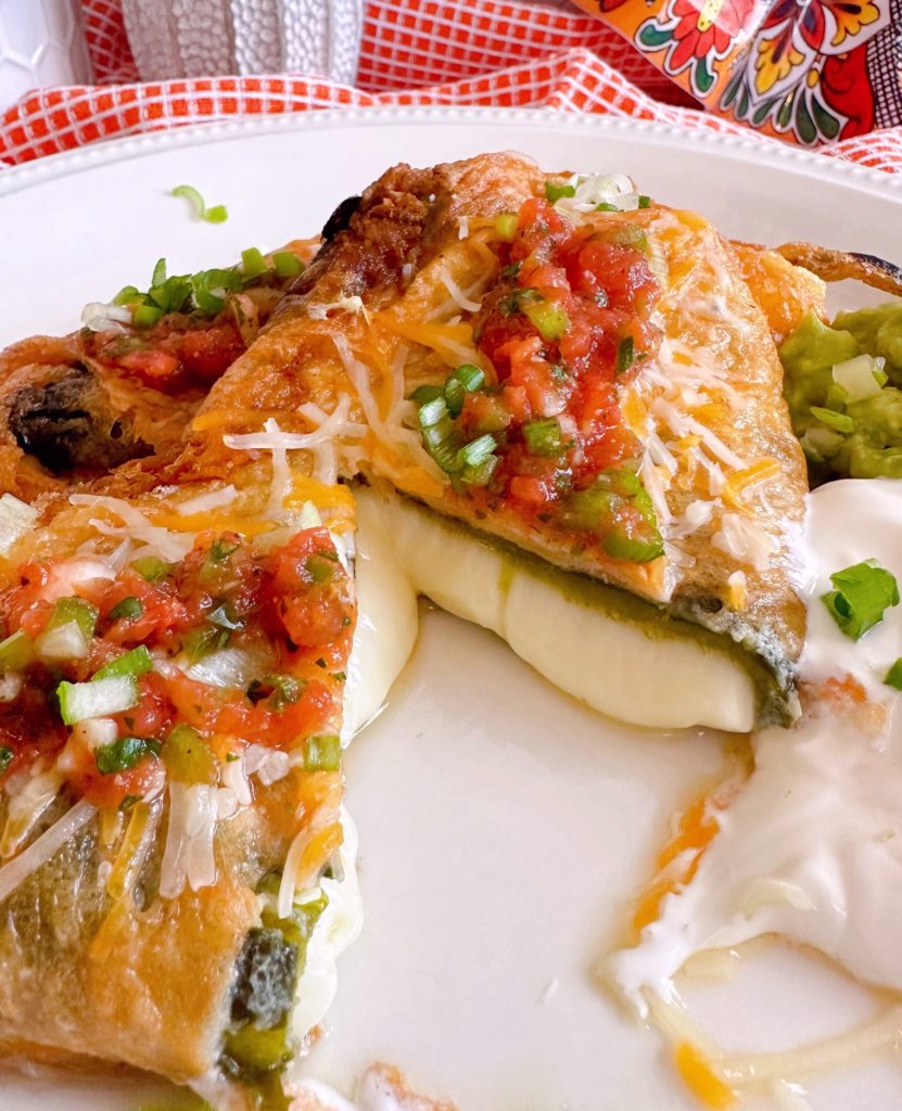 Cut open Chile Relleno's with melted cheese.