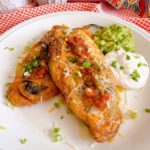 Chile Relleno's served with salsa, guacamole, sour cream, and cheese.