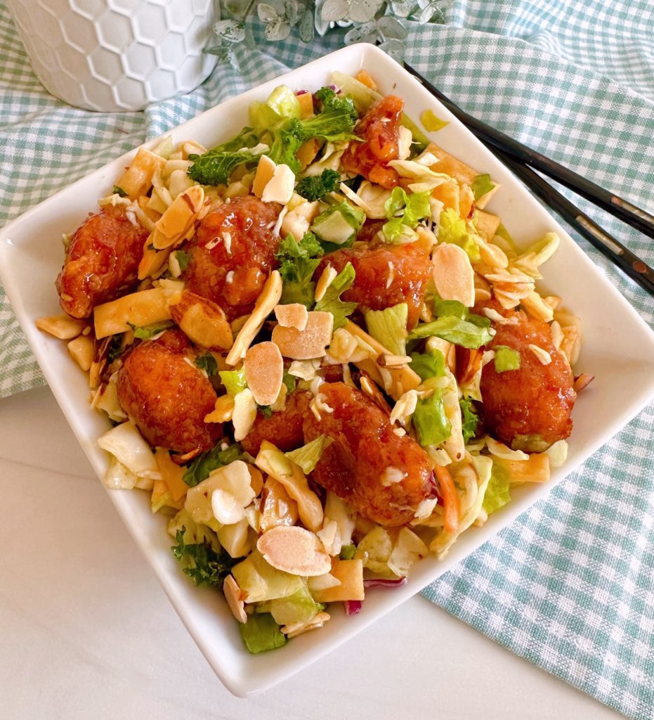 General Tso's Oriental Salad in a white salad bowl.