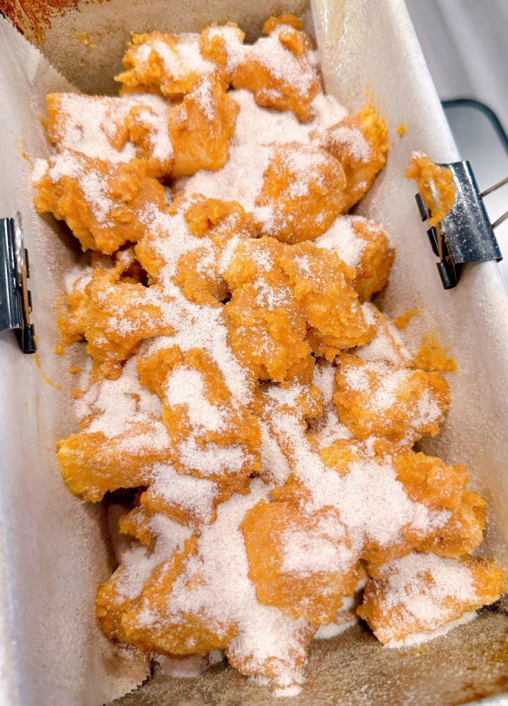 Layers of pumpkin bites coated in cinnamon sugar.