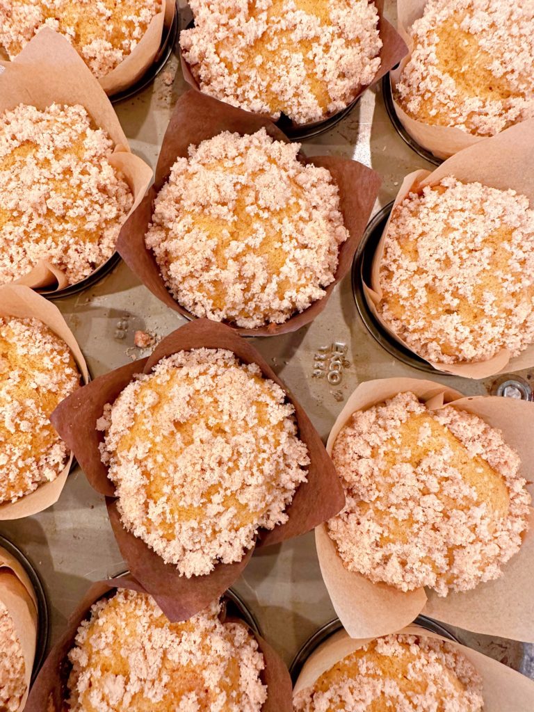 Baked pumpkin muffins on a cooling rack.