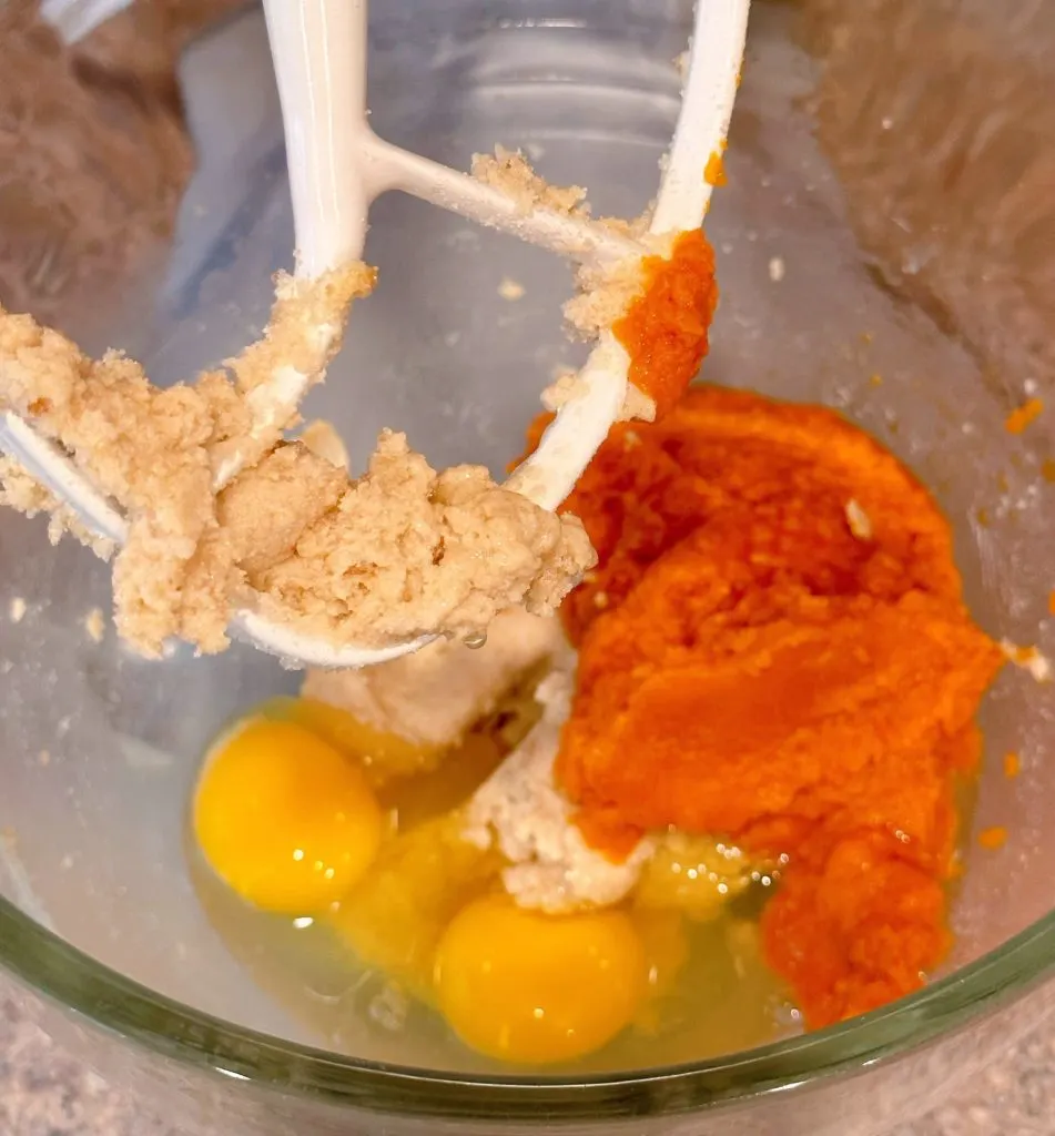 Batter ingredients in the bowl of a stand mixer.