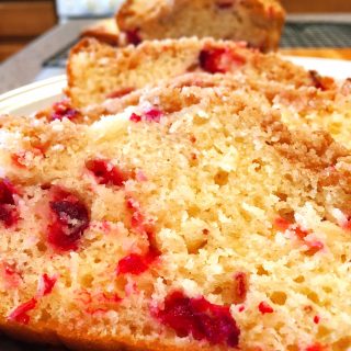 Cranberry Orange Bread sliced and on a serving platter