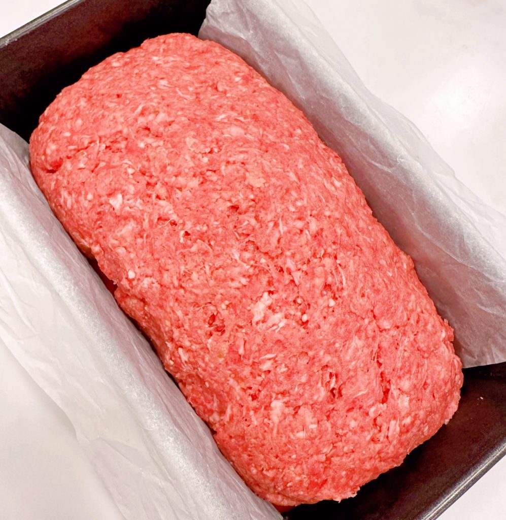 Meatloaf in the pan ready for baking.