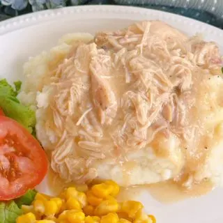 Slow Cooker Chicken and Gravy on a dinner plate.