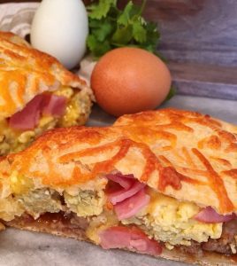 close-up breakfast calzone, sliced.