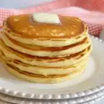 Stack of pancakes with butter but no syrup.