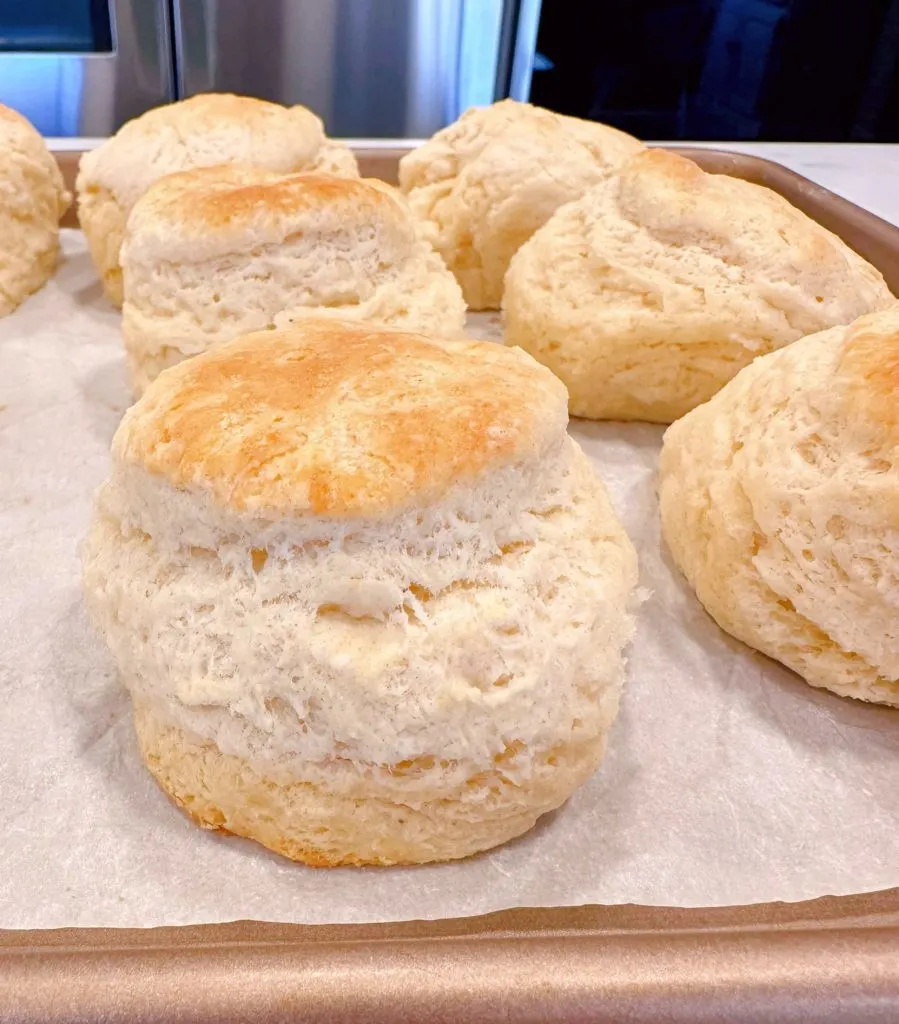 Biscuits on baking sheet right out of the oven.