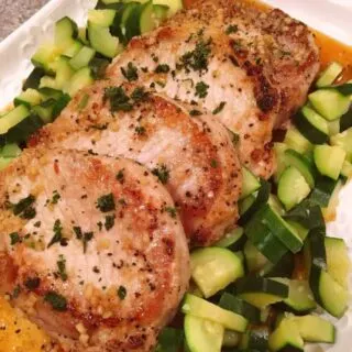 Serving platter fun of skillet honey garlic pork chops