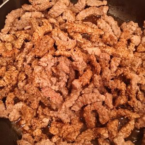 Steak cooking in skillet