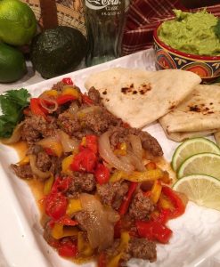 Platter full of beef fajitas