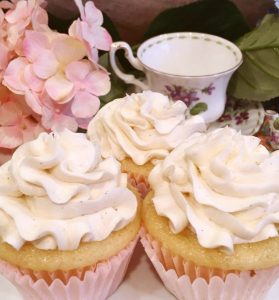 Close up of three vanilla cupcakes