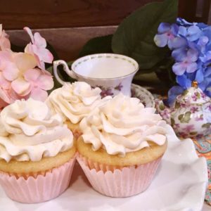 Vanilla cupcakes on cake plate