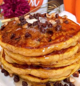 Tall stack of Pumpkin Chocolate Chip Pancakes with Maple Syrup