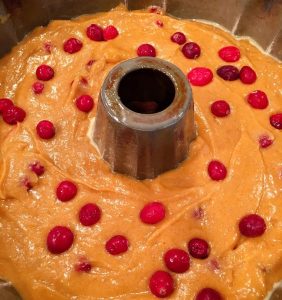 Sprinkle cranberries on top of batter