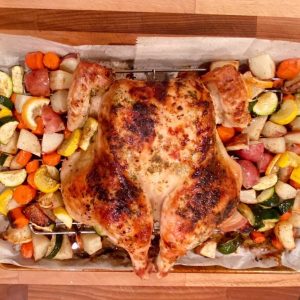 baked chicken lying on cutting board for 10 minutes