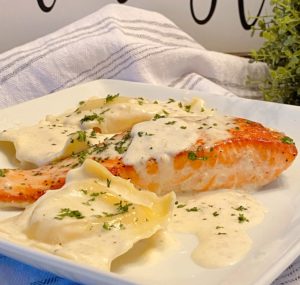 Creamy Tuscan Salmon with Lobster Ravioli