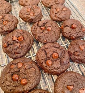 Double Chocolate Chip Cookies on cooling racks