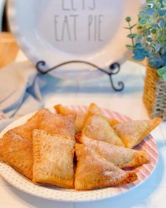 Plate filled with homemade fresh peach hand pies