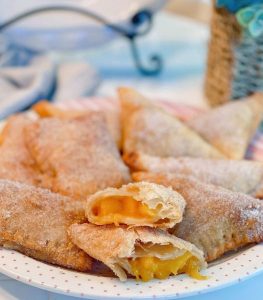 Plate full of fried peach hand pies