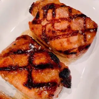 Pork Chops on a white plate.