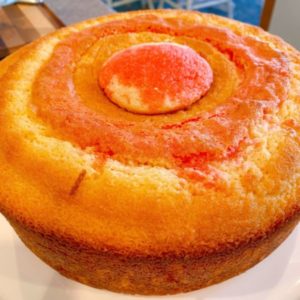 Cupcake in the hole of the bundt cake top.