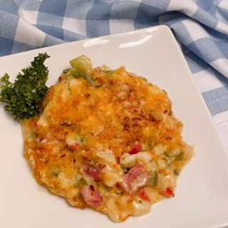 Ham and Broccoli Potato Casserole on a white serving plate.