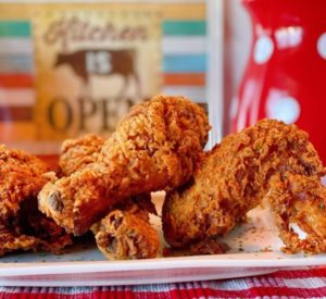 Platter filled with fried chicken ready to eat.