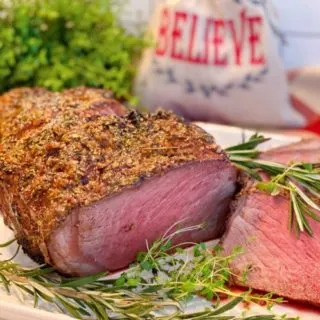 Herb Crust Cross Rib Roast on a serving platter.