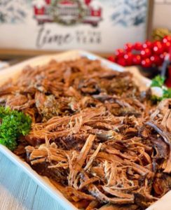 Cross Rib Roast Cooking Method two shredded and on a white platter.