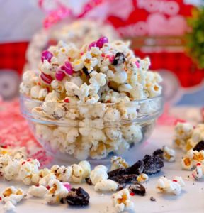 Bowl full of Cookies and Cream Popcorn with colorful M&M's for Valentines day.