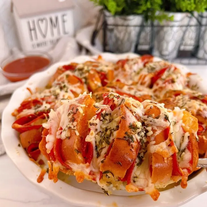 Pizza Sliders in a white baking dish .