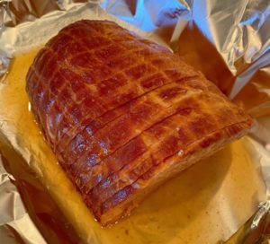 Ham in baking dish ready to bake.