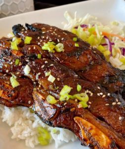 Hawaiian-Style Beef Short Ribs on a bed rice.