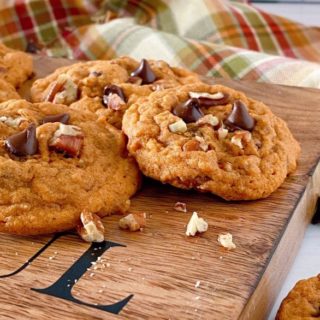 Pumpkin Chocolate Chip Cookies on a board.