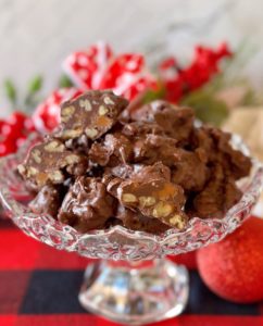 Crockpot Chocolate Turtles in a beautiful candy dish.