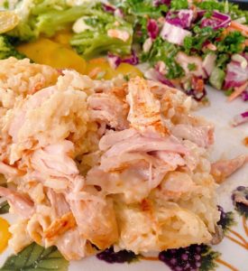 Serving of chicken rice casserole on a dinner plate.