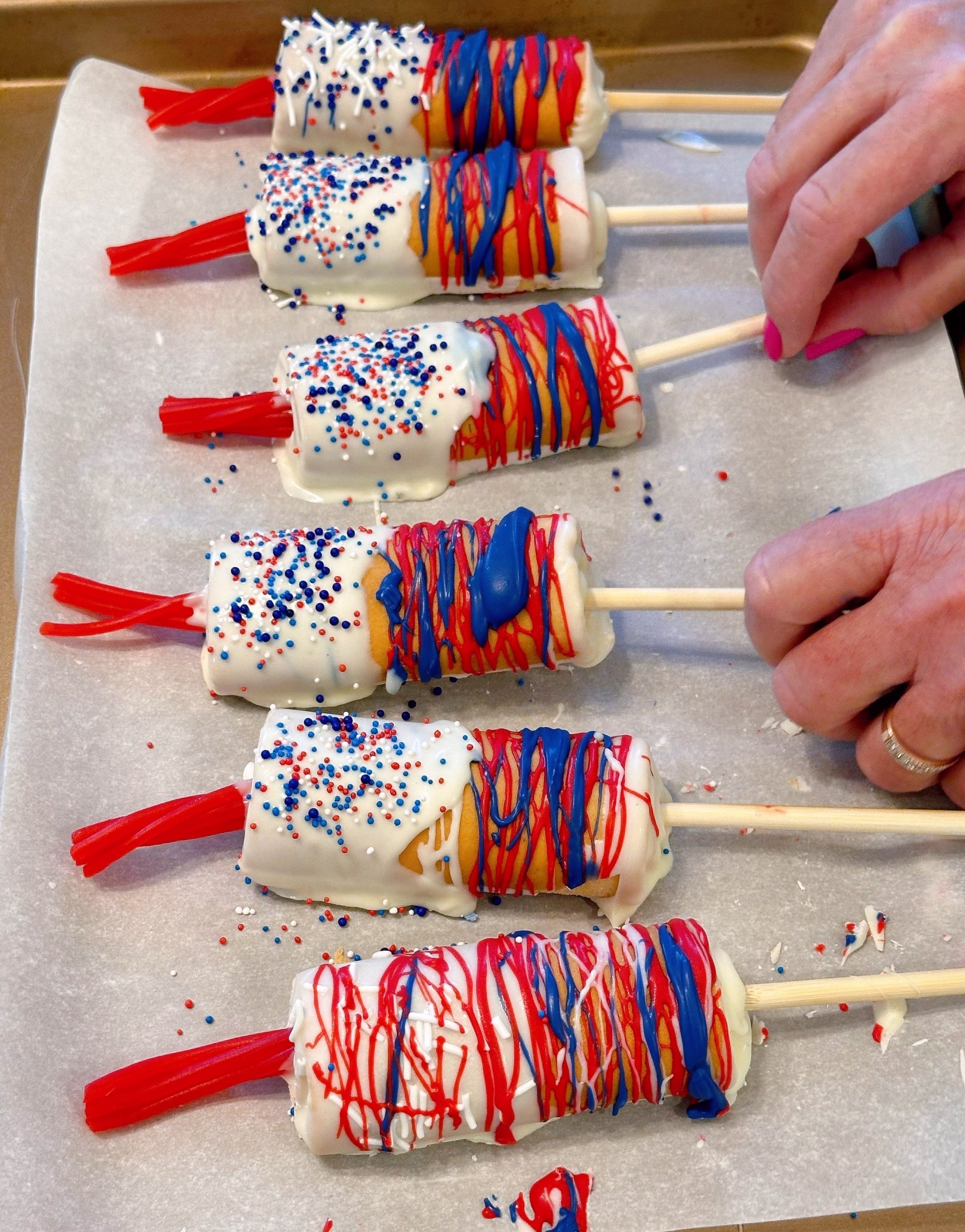 Firecracker Swiss Roll Cake Pops | Norine's Nest