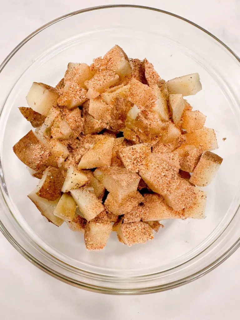 Potatoes are sprinkled with seasoning mix.