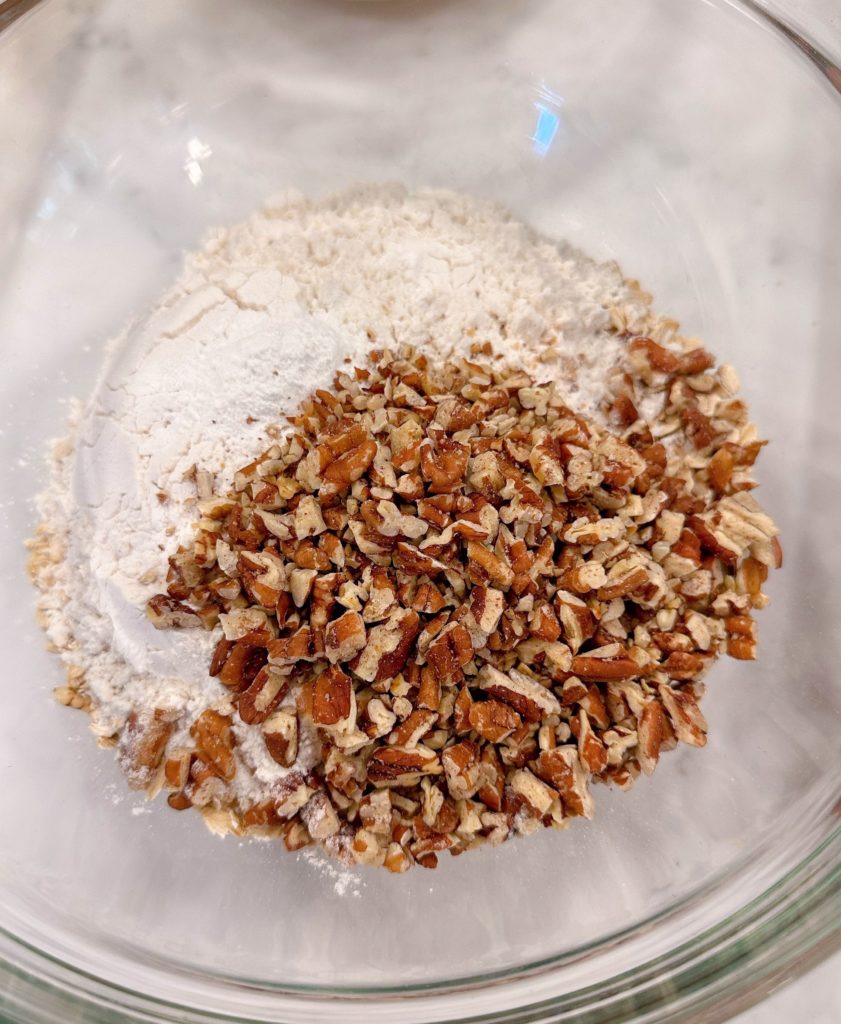 Bowl with dry ingredients and pecan.