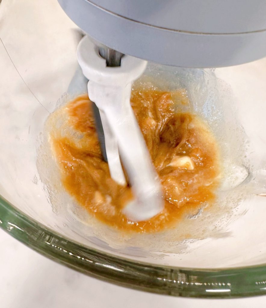 Brown sugar and softened butter in mixing bowl.