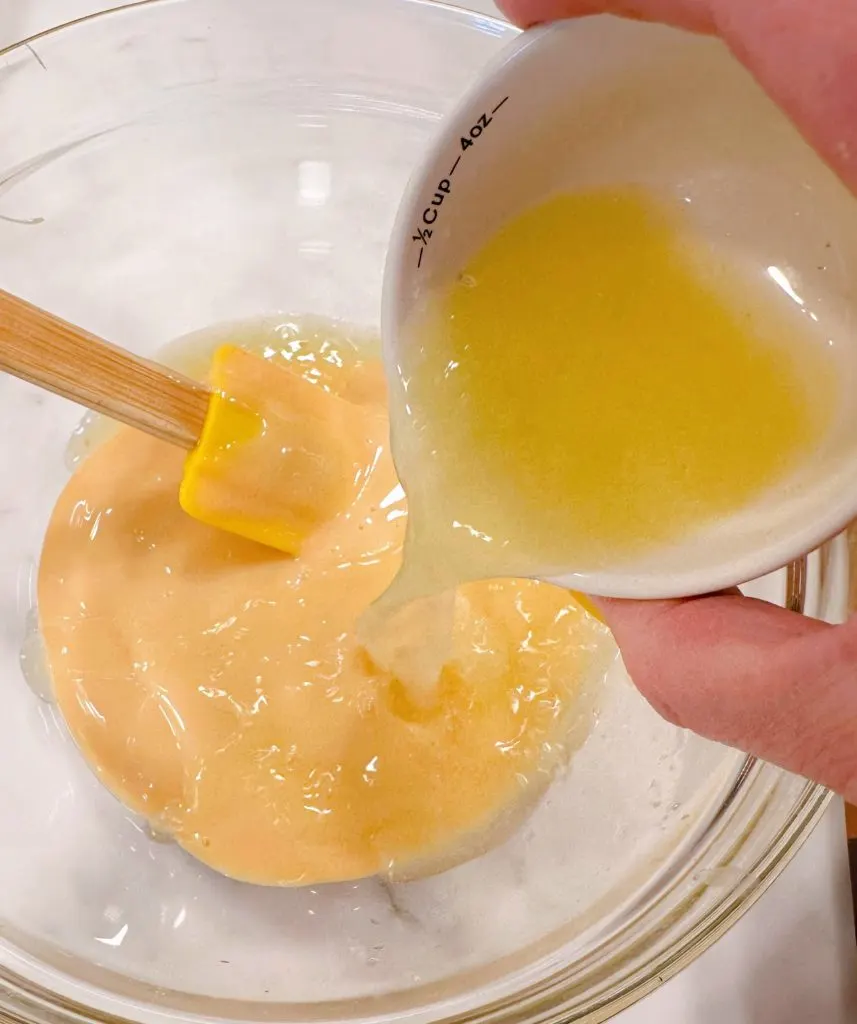 Adding lemon juice to sweetened condensed milk.