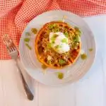 Overhead shot of stuffed cornbread waffle with chili.